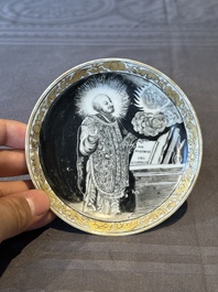 A rare Chinese grisaille and gilt cup and saucer with Ignatius of Loyola, Qianlong