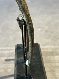 A varied collection of six Chinese bronze belt hooks, Warring States period and Western Han