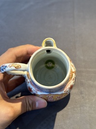A Chinese English-decorated blue and white jug and cover, Kangxi