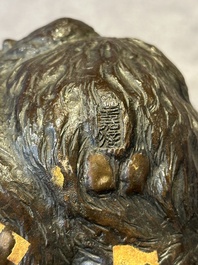 A Japanese bronze okimono with three monkeys, Yoshinobu seal mark, Meiji period