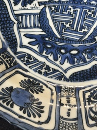A Chinese blue and white kraak porcelain dish with flowers in a jardiniere, Wanli
