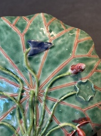 A Chinese famille rose relief-decorated 'lotus' cup and saucer, Yongzheng