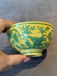 A pair of Chinese yellow-ground 'peach and bird' bowls, Qianlong mark and probably of the period