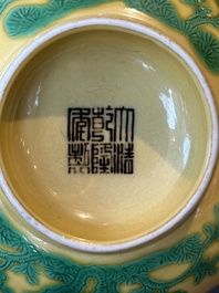 A pair of Chinese yellow-ground 'peach and bird' bowls, Qianlong mark and probably of the period