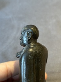 A small Chinese bronze figure of a Luohan, Ming