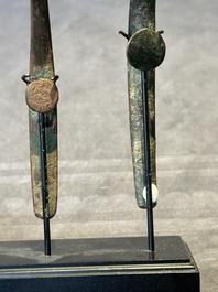 A varied collection of six Chinese bronze belt hooks, Warring States period and Western Han