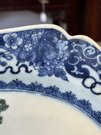 A Chinese famille rose 'He Xiangu' charger with a blue and white border, Qianlong