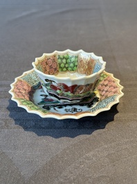 A Chinese famille rose cup and saucer with a reclined lady, Qianlong