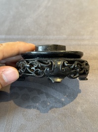 A small Chinese bronze figure of a Luohan, Ming