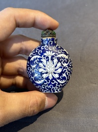 Two Chinese famille rose 'lotus scroll' snuff bottles and a flamb&eacute;-glazed snuff bottle, 19th C.