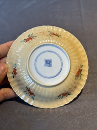A pair of Chinese famille verte cafe-au-lait-ground cups and saucers, Kangxi