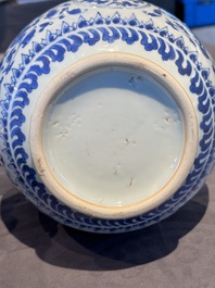 A Chinese blue and white 'lotus scroll' bottle vase, Transitional period