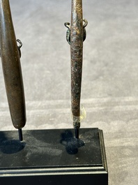 A varied collection of six Chinese bronze belt hooks, Warring States period and Western Han