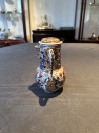 A Chinese English-decorated blue and white jug and cover, Kangxi