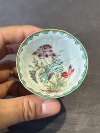 A Chinese famille rose relief-decorated 'lotus' cup and saucer, Yongzheng