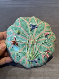 A Chinese famille rose relief-decorated 'lotus' cup and saucer, Yongzheng