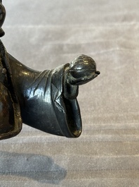 A Chinese bronze vase and a Taoist figure-shaped incense burner, Ming