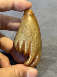 A rare Chinese rhinoceros horn snuff bottle in the shape of a Buddha hand, 19th C.