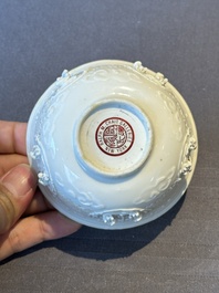 A pair of rare Chinese reticulated white-glazed biscuit 'Eight Immortals and Shoulao' bowls, Wanli