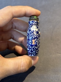 Two Chinese famille rose 'lotus scroll' snuff bottles and a flamb&eacute;-glazed snuff bottle, 19th C.