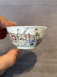 A Chinese famille rose cup and saucer with music making ladies, Yongzheng/Qianlong
