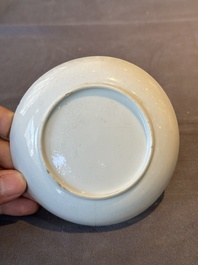 A Chinese Canton famille rose 'mandarin subject' covered teapot and a pair of saucers, Qianlong