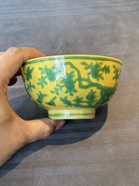 A pair of Chinese yellow-ground 'peach and bird' bowls, Qianlong mark and probably of the period