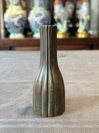 A rare Chinese ribbed bronze flower arranging vase, Ming