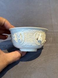 A pair of rare Chinese reticulated white-glazed biscuit 'Eight Immortals and Shoulao' bowls, Wanli