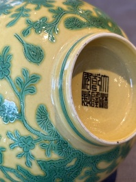 A pair of Chinese yellow-ground 'peach and bird' bowls, Qianlong mark and probably of the period