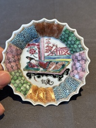 A Chinese famille rose cup and saucer with a reclined lady, Qianlong