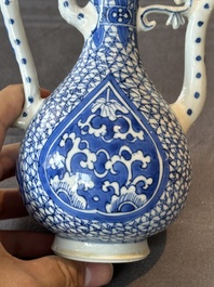 A pair of Chinese blue and white ewers with floral design, Kangxi