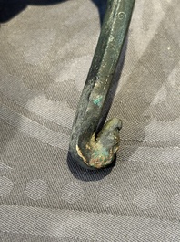 A varied collection of six Chinese bronze belt hooks, Warring States period and Western Han