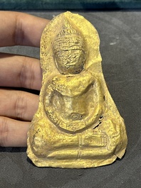 Four sheets of gold repouss&eacute; votive plaques of Buddha Sakyamuni, Burma, 12th C.