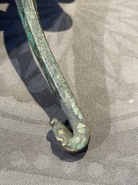 A varied collection of six Chinese bronze belt hooks, Warring States period and Western Han