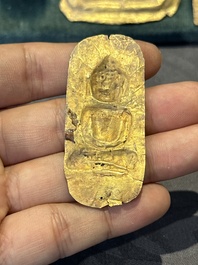 Four sheets of gold repouss&eacute; votive plaques of Buddha Sakyamuni, Burma, 12th C.