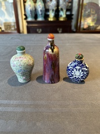 Two Chinese famille rose 'lotus scroll' snuff bottles and a flamb&eacute;-glazed snuff bottle, 19th C.