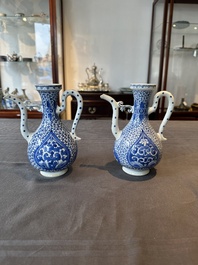 A pair of Chinese blue and white ewers with floral design, Kangxi