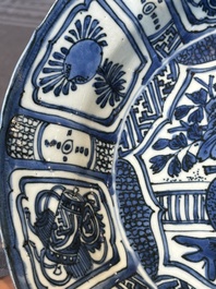 A Chinese blue and white kraak porcelain dish with flowers in a jardiniere, Wanli