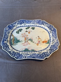 A Chinese famille rose 'He Xiangu' charger with a blue and white border, Qianlong