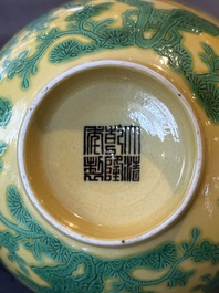 A pair of Chinese yellow-ground 'peach and bird' bowls, Qianlong mark and probably of the period