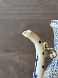 A pair of Chinese blue and white ewers with floral design, Kangxi