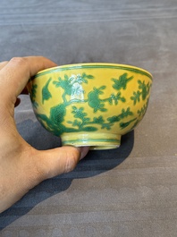 A pair of Chinese yellow-ground 'peach and bird' bowls, Qianlong mark and probably of the period