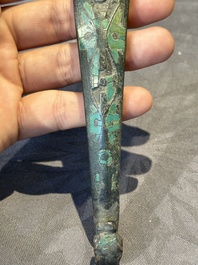 A varied collection of six Chinese bronze belt hooks, Warring States period and Western Han
