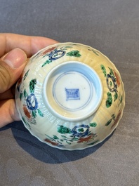 A pair of Chinese famille verte cafe-au-lait-ground cups and saucers, Kangxi