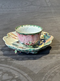 A Chinese famille rose relief-decorated 'lotus' cup and saucer, Yongzheng