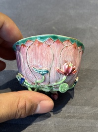 A Chinese famille rose relief-decorated 'lotus' cup and saucer, Yongzheng
