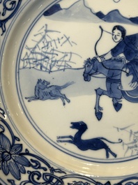 A pair of Chinese blue and white 'hunting scene' plates, Qi Yu Bao Ding Zhi Zhen 奇玉寶鼎之珍 mark, Kangxi