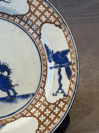 A pair of Chinese 'leaping pekinese' plates, possibly after a design by Cornelis Pronk, Qianlong, ca. 1740