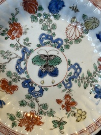 A pair of Chinese famille verte cafe-au-lait-ground cups and saucers, Kangxi